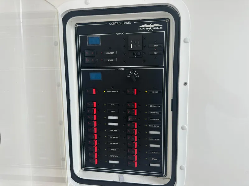 Slide: The Image of Control panel of 2020 Invincible 39 Open Fisherman boat with various switches and indicators. - 14