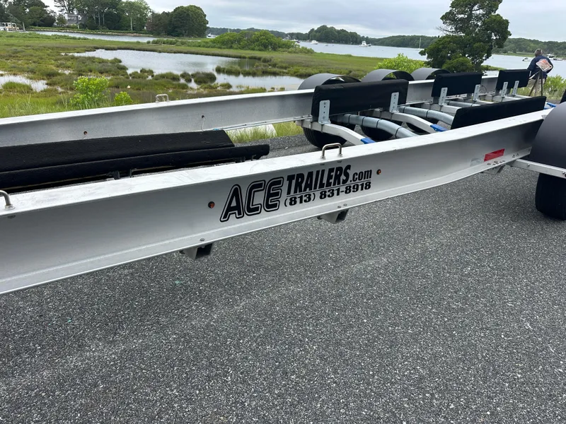 Slide: The Image of Trailer for 2020 Invincible 39 Open Fisherman by Ace Trailers, near scenic waterway. - 21