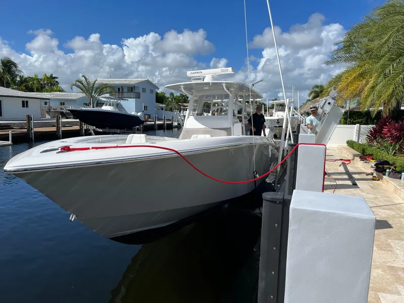 Slide: The Image of 2020 Invincible 39 Open Fisherman boat docked in sunny marina setting. - 3