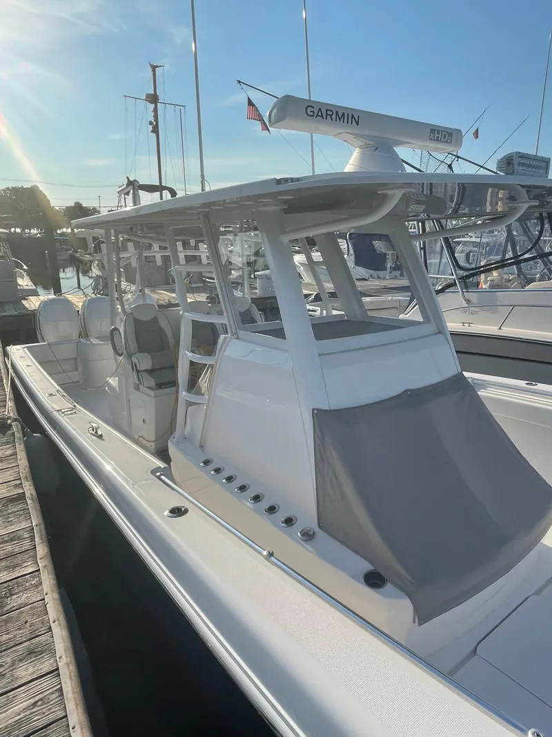 Slide: The Image of 2020 Invincible 39 Open Fisherman boat docked, featuring Garmin radar. - 4