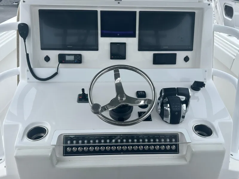 Slide: The Image of 2020 Invincible 39 Open Fisherman helm with dual screens and controls. - 5