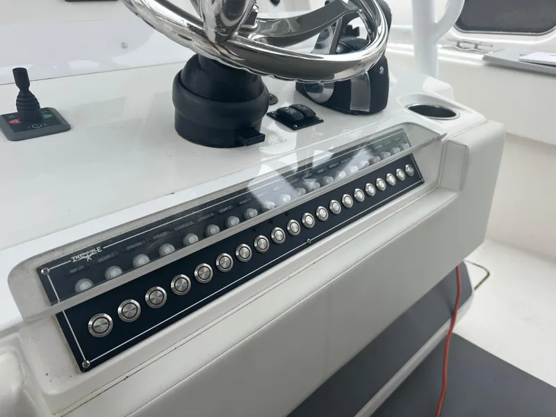 Slide: The Image of Control panel of a 2020 Invincible 39 Open Fisherman boat with steering wheel. - 7