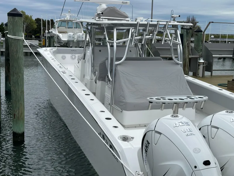 Slide: The Image of 2021 SeaHunter 46 CTS boat docked, featuring dual Yamaha 425 V8 engines. - 10