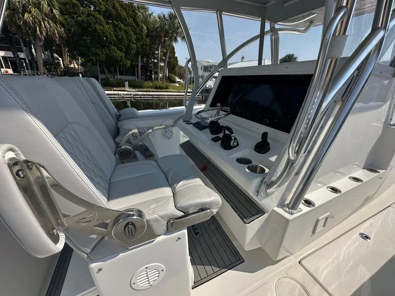 Slide: The Image of Interior of 2021 SeaHunter 46 CTS boat with modern helm and seating. - 4