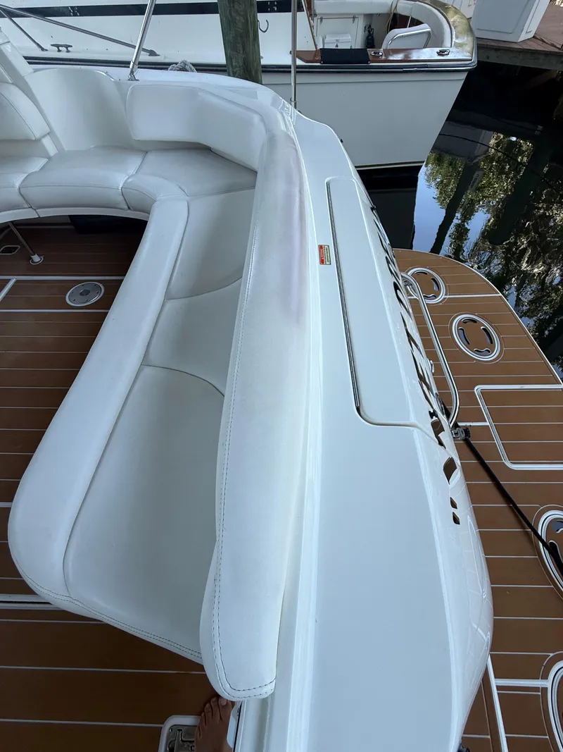 Slide: The Image of 2003 Sea Ray 380 Sundancer boat with white seating and teak deck. - 14