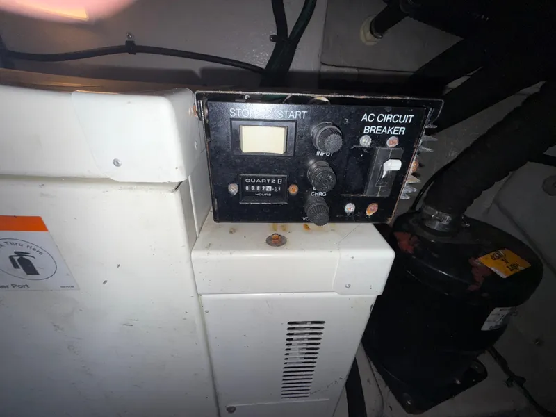 Slide: The Image of Control panel of a 2003 Sea Ray 380 Sundancer boat with AC circuit breaker. - 31