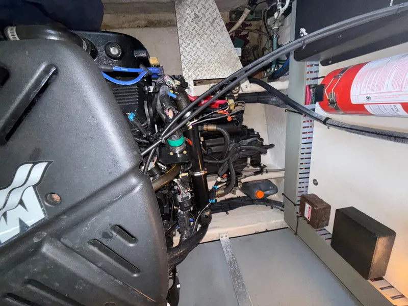 Slide: The Image of Engine compartment of a 2003 Sea Ray 380 Sundancer with visible components and fire extinguisher. - 33