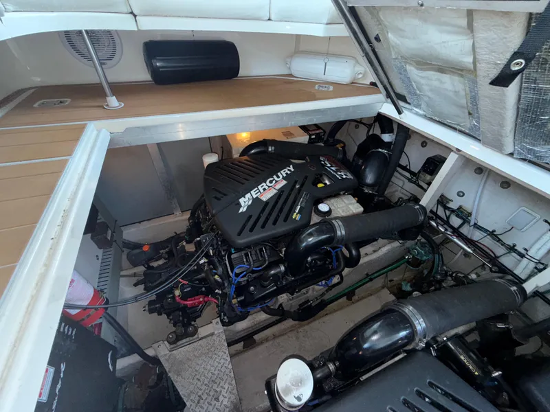 Slide: The Image of Engine compartment of 2003 Sea Ray 380 Sundancer with Mercury engine visible. - 34