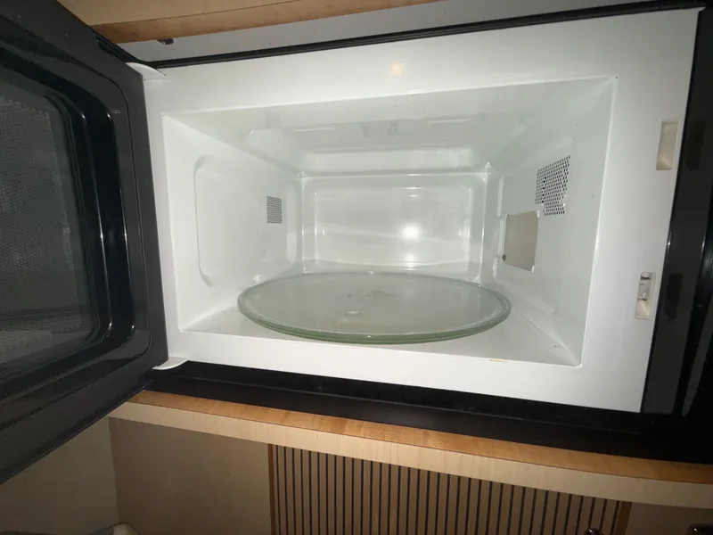 Slide: The Image of Open microwave inside a 2003 Sea Ray 380 Sundancer yacht kitchen. - 45