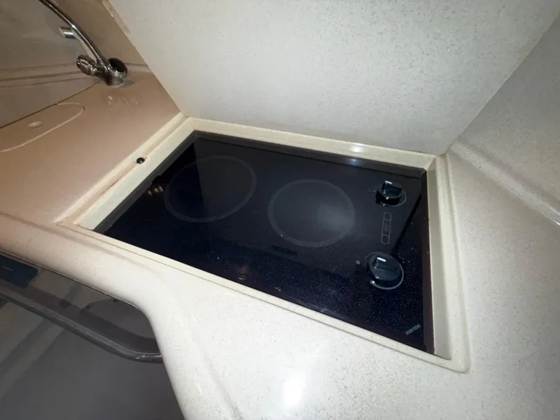 Slide: The Image of Stovetop in 2003 Sea Ray 380 Sundancer yacht kitchen area. - 47