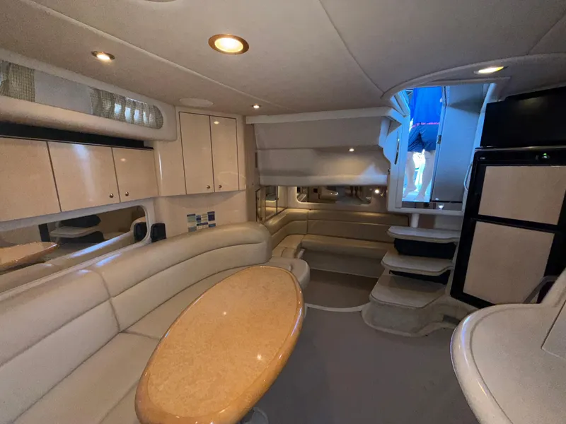 Slide: The Image of Luxurious interior of 2003 Sea Ray 380 Sundancer yacht with elegant seating and modern amenities. - 49