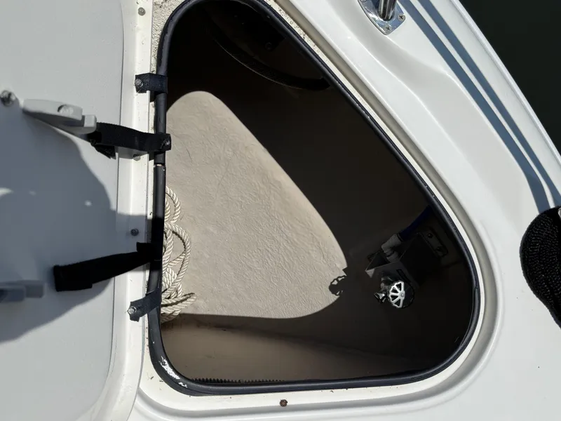 Slide: The Image of Open hatch on a 2003 Sea Ray 380 Sundancer boat, showing interior storage space. - 9