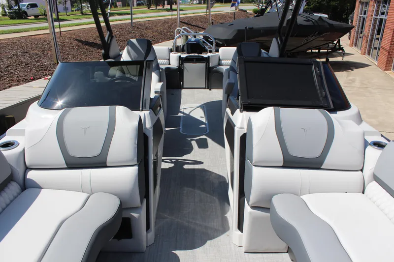 Slide: The Image of 2025 Tahoe Pontoon Cascade Quad Lounge Windshield interior with modern seating and sleek design. - 12