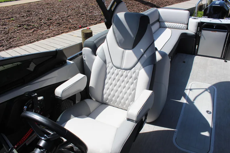 Slide: The Image of 2025 Tahoe Pontoon Cascade Quad Lounge Windshield interior with luxurious seating and modern design. - 13