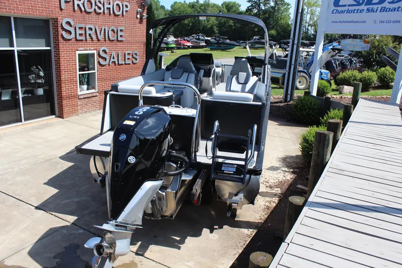 Slide: The Image of 2025 Tahoe Pontoon Cascade Quad Lounge Windshield at dealership, showcasing sleek design and powerful engine. - 3