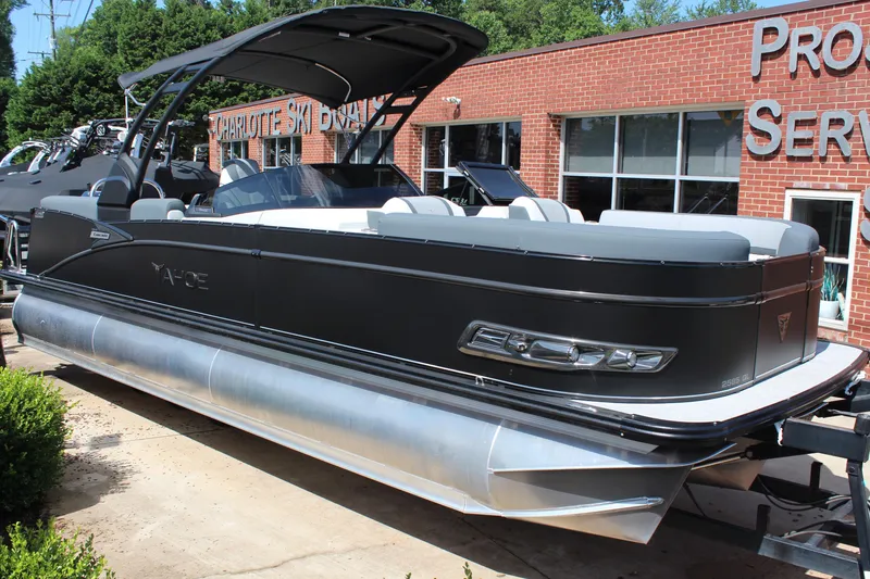 Slide: The Image of 2025 Tahoe Pontoon Cascade Quad Lounge Windshield boat displayed outdoors. - 6