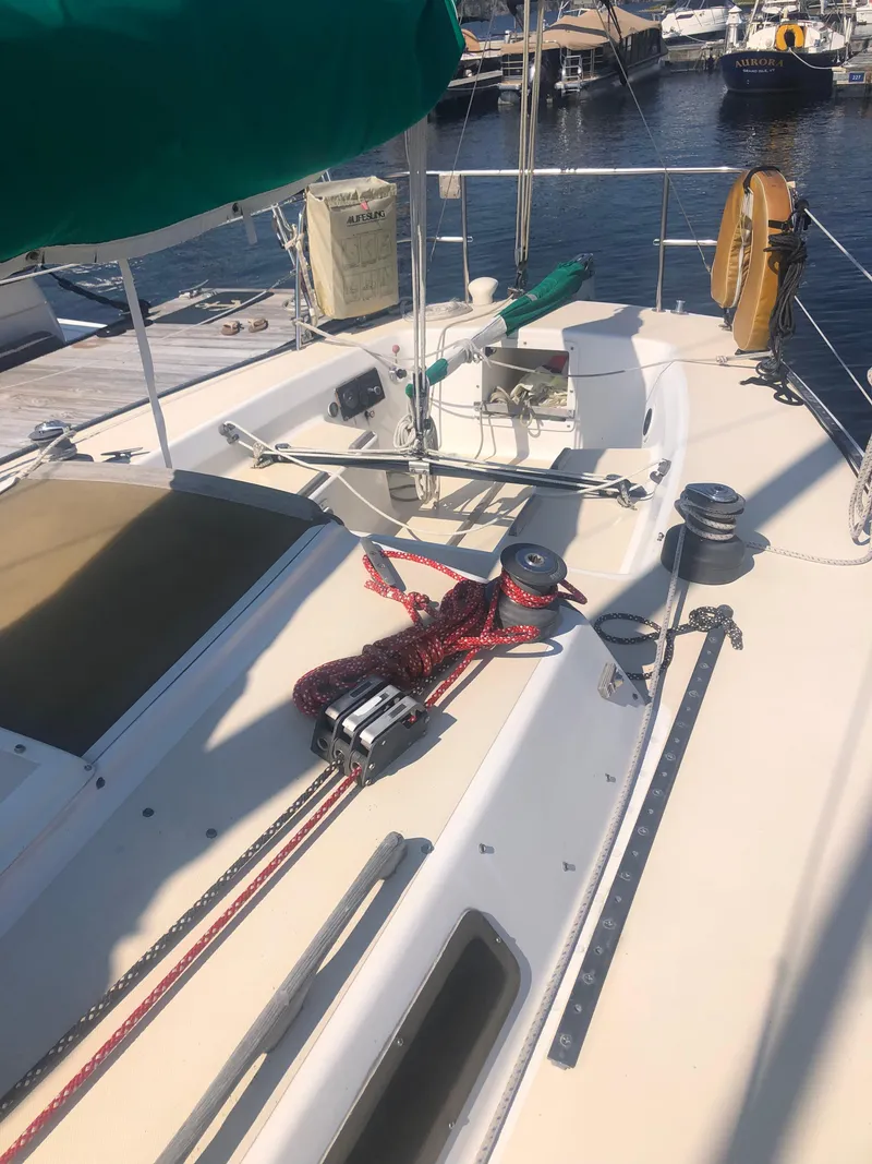 Slide: The Image of 1987 J Boats J29 sailboat deck with ropes and winches at marina. - 15