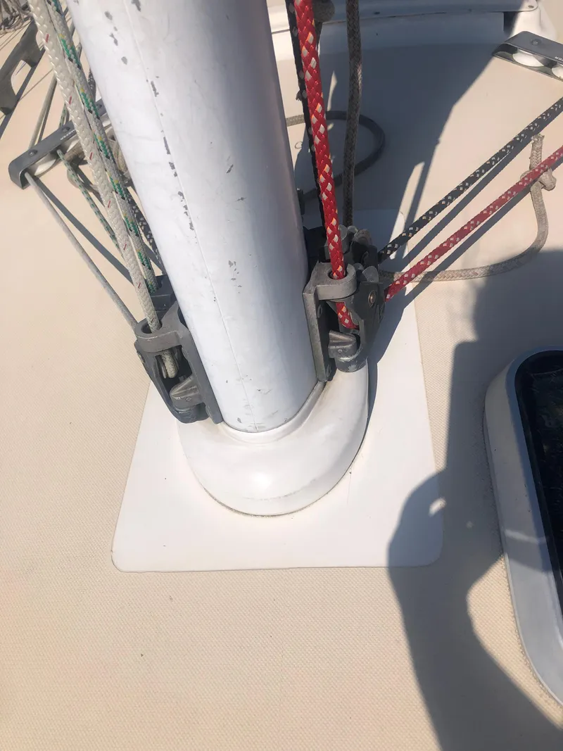Slide: The Image of Mast base and rigging on a 1987 J Boats J29 sailboat deck. - 16