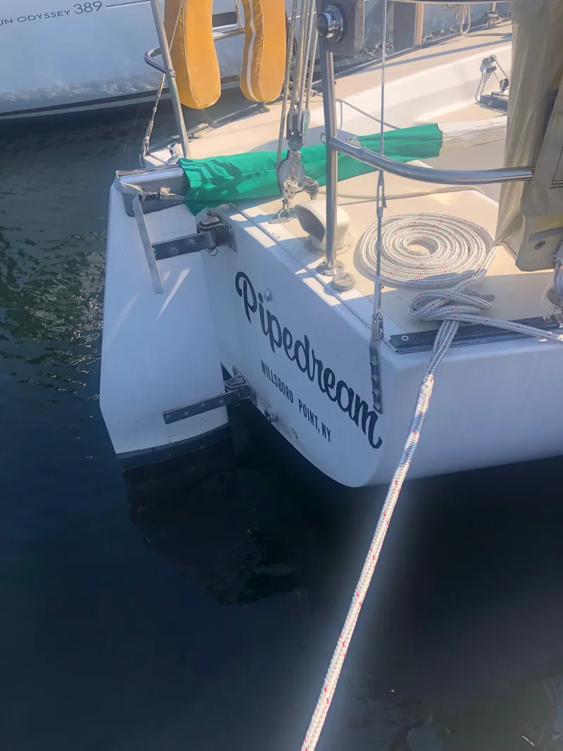 Slide: The Image of 1987 J Boats J29 sailboat named "Pipedream" docked at Hillsboro Point, NY. - 17