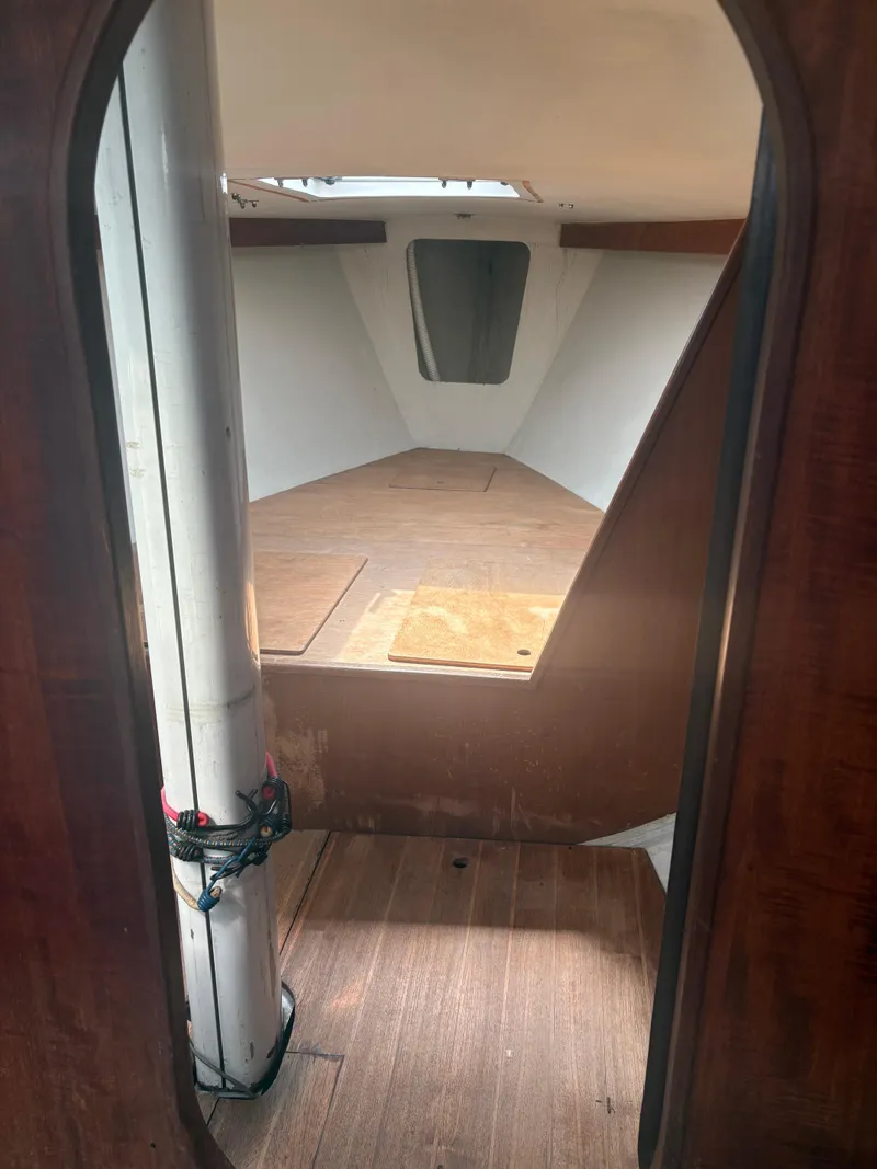 Slide: The Image of Interior view of 1987 J Boats J29 sailboat cabin with wooden flooring. - 30