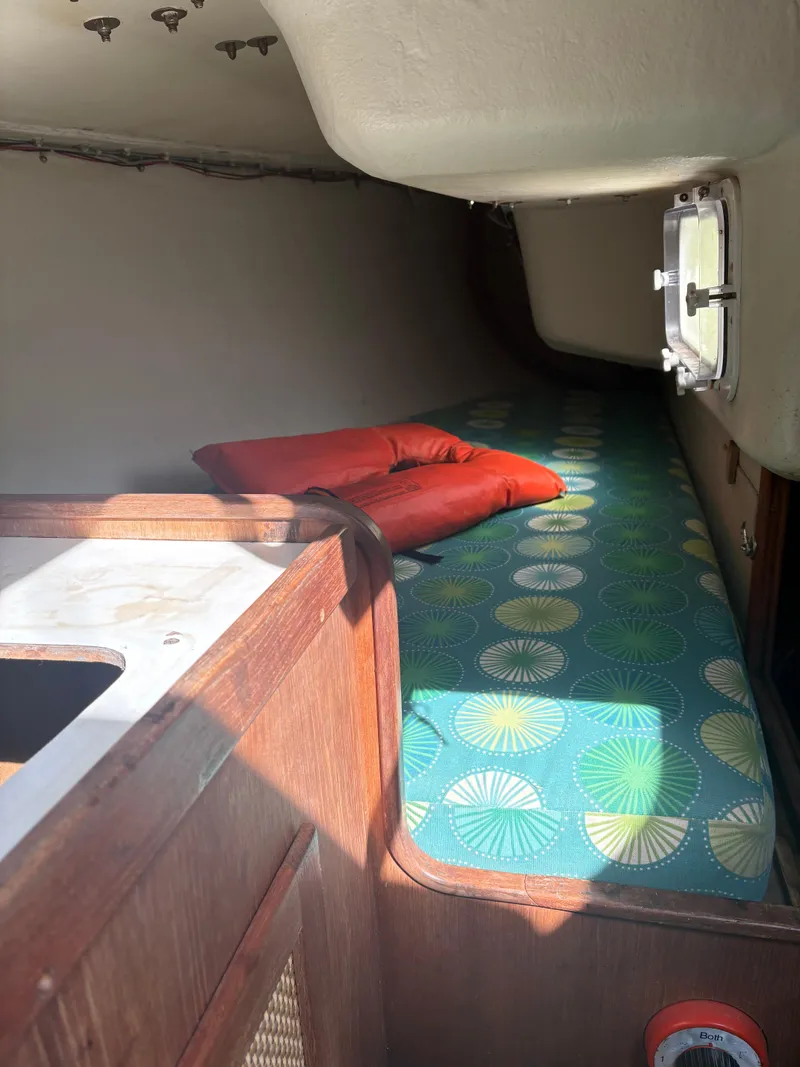 Slide: The Image of Cozy cabin interior of 1987 J Boats J29 with colorful bedding and wooden accents. - 41