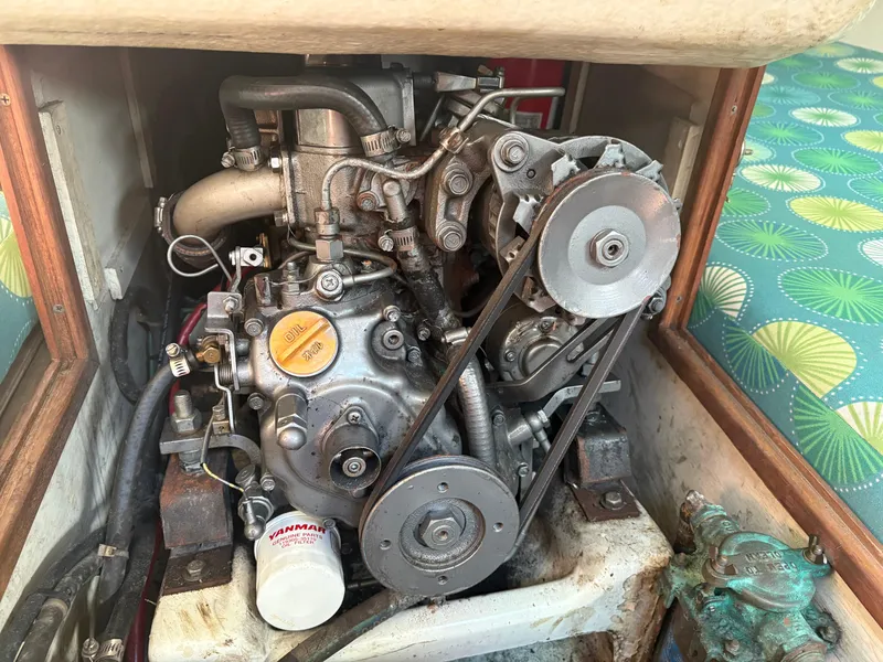 Slide: The Image of 1987 J Boats J29 engine compartment with visible Yanmar engine components. - 42