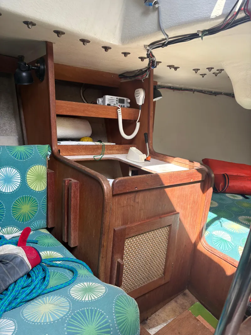Slide: The Image of Interior of 1987 J Boats J29 sailboat with wood cabinetry and colorful seating. - 46