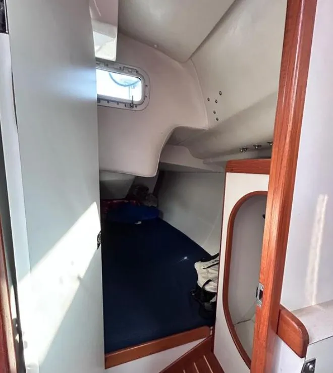 Slide: The Image of Interior cabin of a 2006 J Boats J/124 sailboat with wooden accents. - 29