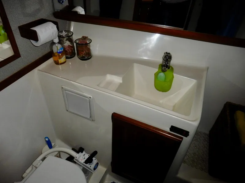 Slide: The Image of Bathroom interior of 1992 Bayliner 3288 Motoryacht with sink and toilet. - 14