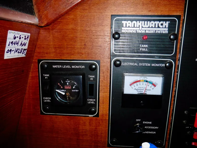 Slide: The Image of Control panel of a 1992 Bayliner 3288 Motoryacht with tank and electrical monitors. - 17