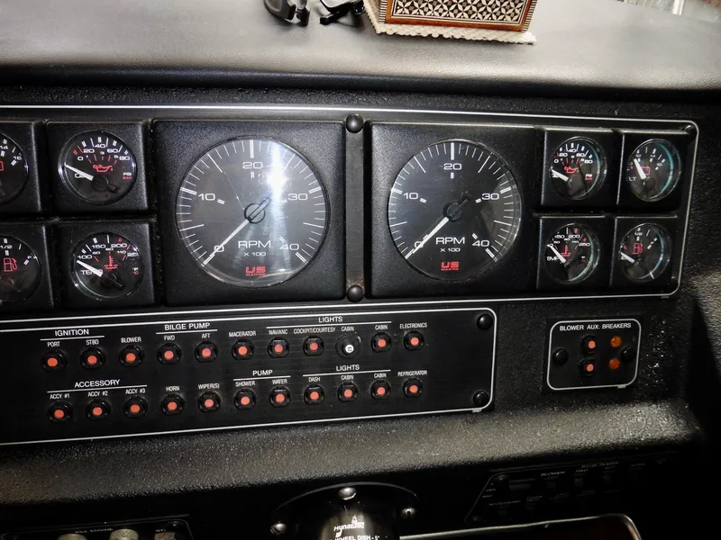 Slide: The Image of Dashboard of a 1992 Bayliner 3288 Motoryacht with gauges and control switches. - 19
