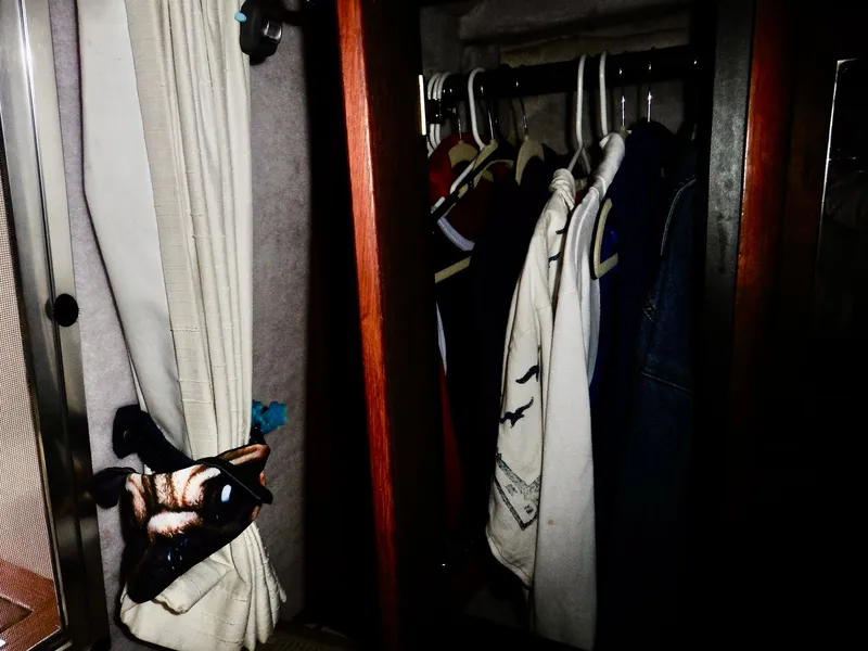 Slide: The Image of Clothes hanging in a closet on a 1992 Bayliner 3288 Motoryacht. - 24