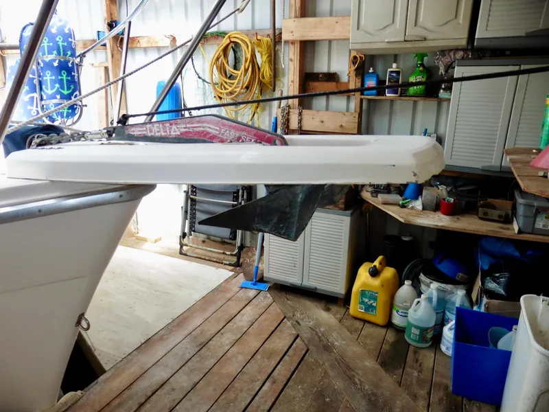 Slide: The Image of 1992 Bayliner 3288 Motoryacht in a workshop, showing anchor and storage shelves. - 3