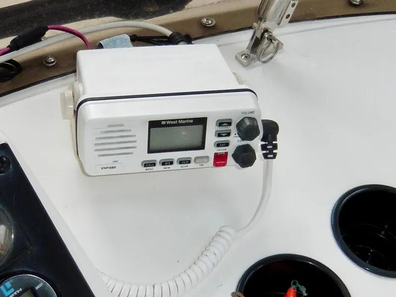 Slide: The Image of VHF radio on 1992 Bayliner 3288 Motoryacht dashboard, featuring West Marine model VHF480. - 37