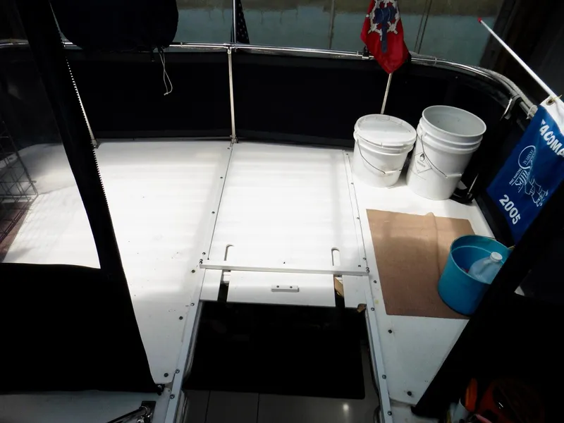 Slide: The Image of 1992 Bayliner 3288 Motoryacht deck with buckets and flags. - 39