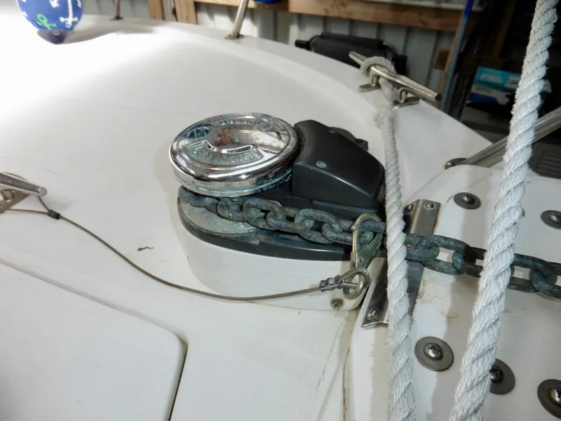 Slide: The Image of 1992 Bayliner 3288 Motoryacht anchor windlass with chain and rope on deck. - 4