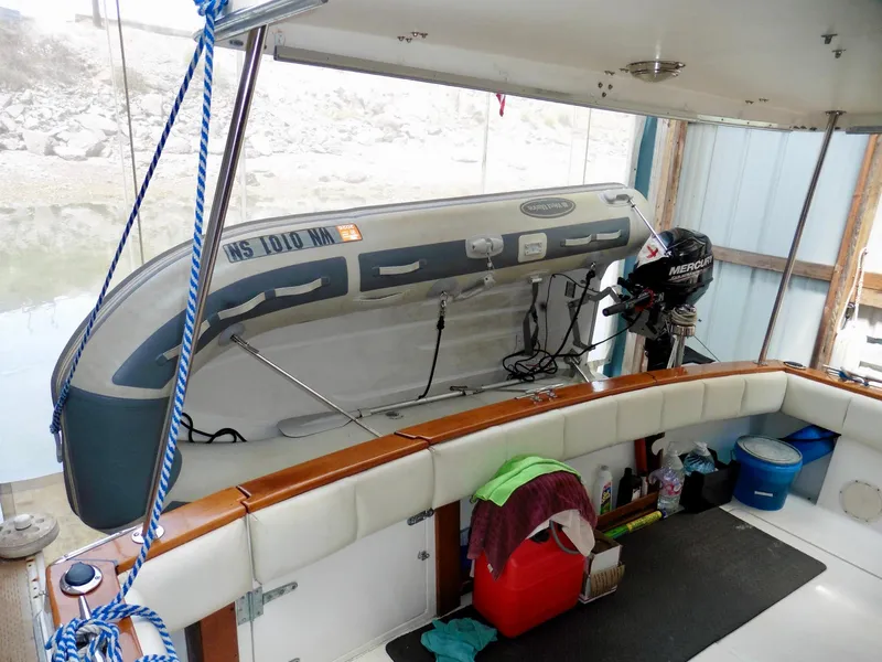 Slide: The Image of 1992 Bayliner 3288 Motoryacht interior with inflatable boat and Mercury outboard motor. - 44
