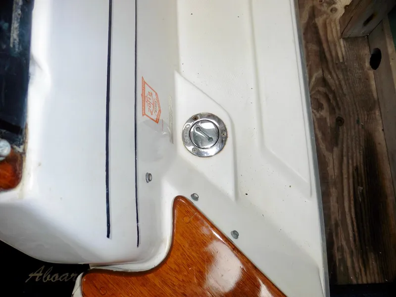 Slide: The Image of 1992 Bayliner 3288 Motoryacht deck detail with wood finish and metal fixture. - 9