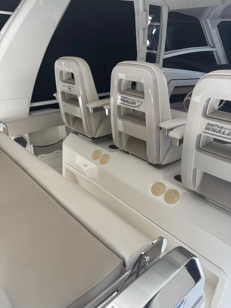 Slide: The Image of 2017 Boston Whaler 420 Outrage interior with sleek seating and modern design. - 20