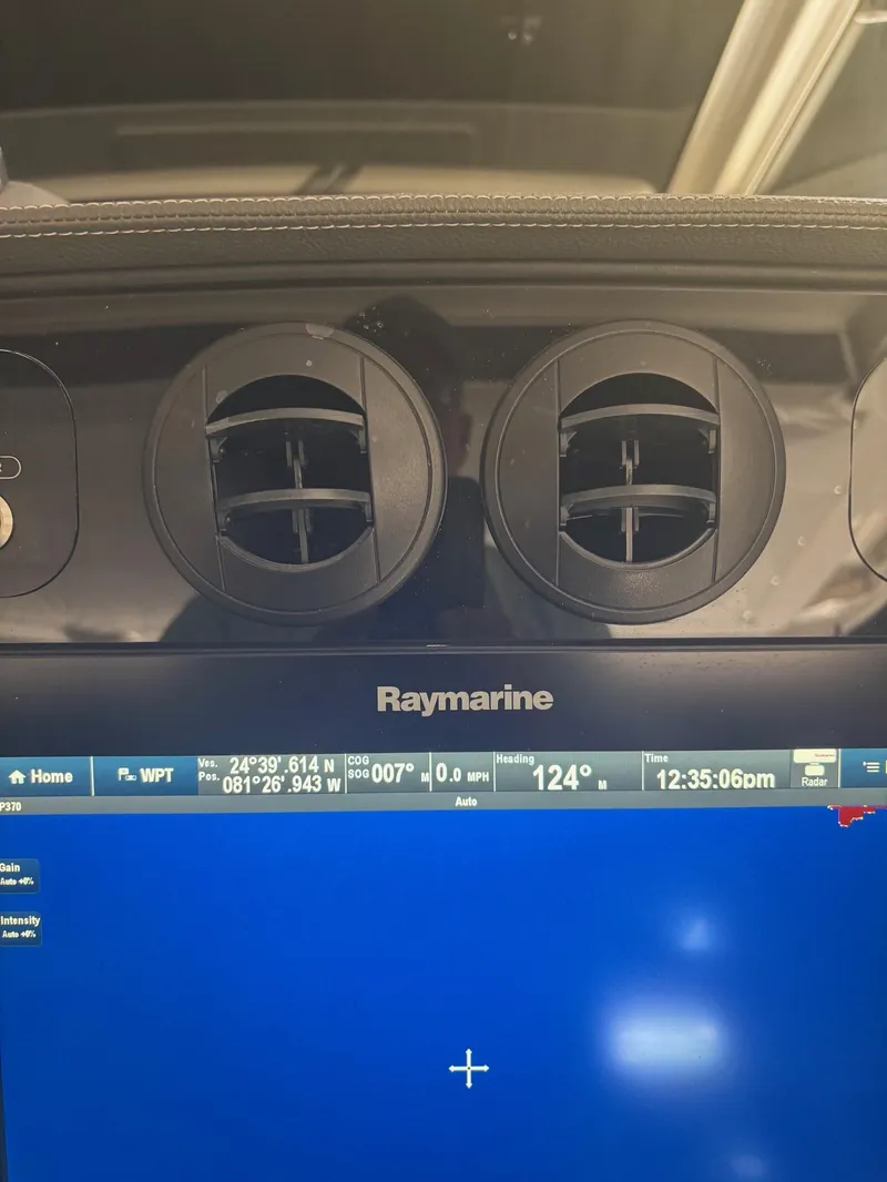 Slide: The Image of Control panel of a 2017 Boston Whaler 420 Outrage with Raymarine display. - 23