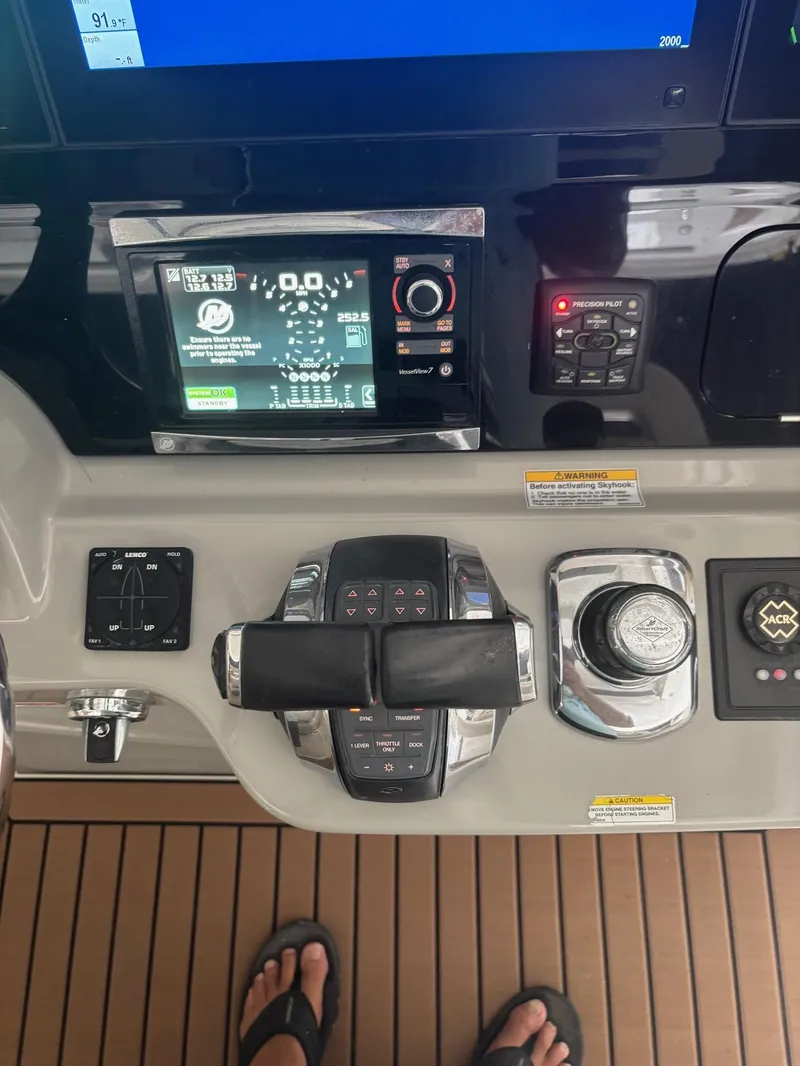 Slide: The Image of Control panel of a 2017 Boston Whaler 420 Outrage boat with navigation displays. - 24