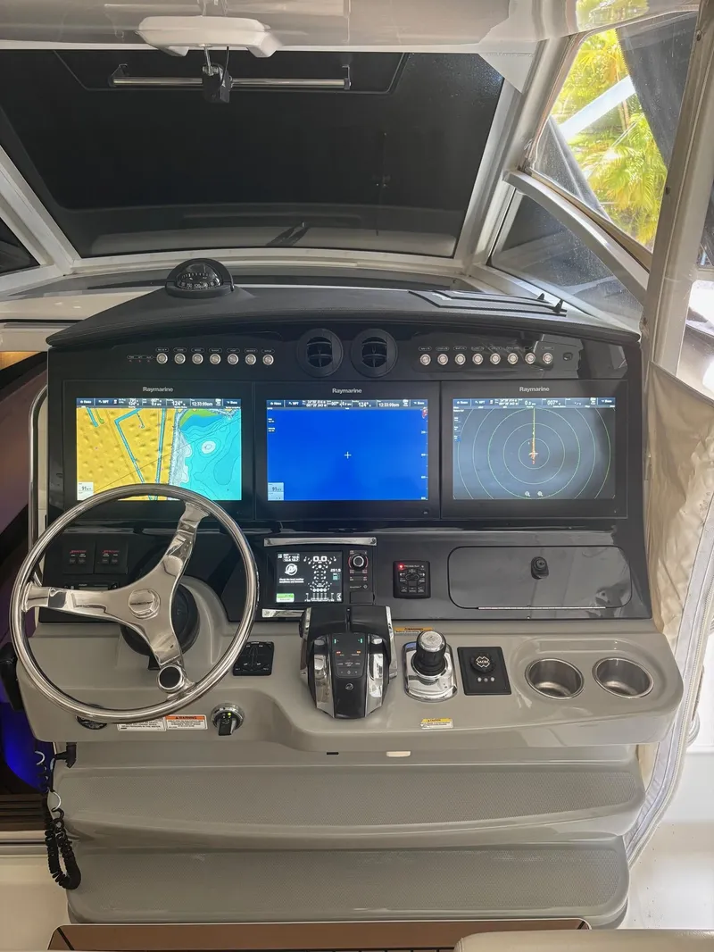 Slide: The Image of 2017 Boston Whaler 420 Outrage helm with advanced navigation displays and controls. - 27