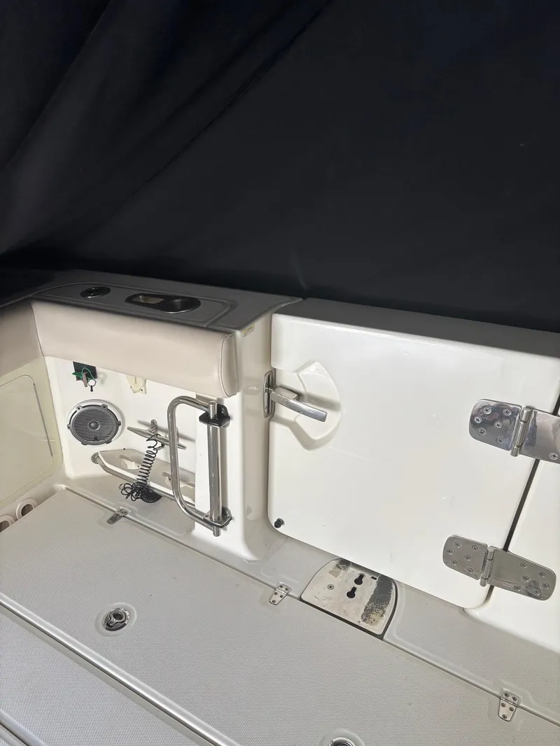 Slide: The Image of 2017 Boston Whaler 420 Outrage boat interior with stainless steel fixtures and storage compartments. - 30