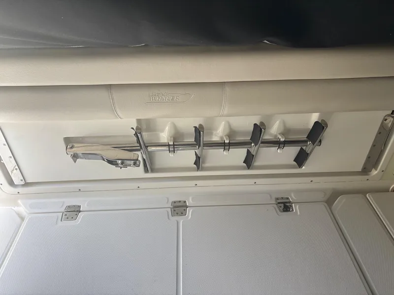 Slide: The Image of Interior of a 2017 Boston Whaler 420 Outrage boat, featuring rod holders. - 31