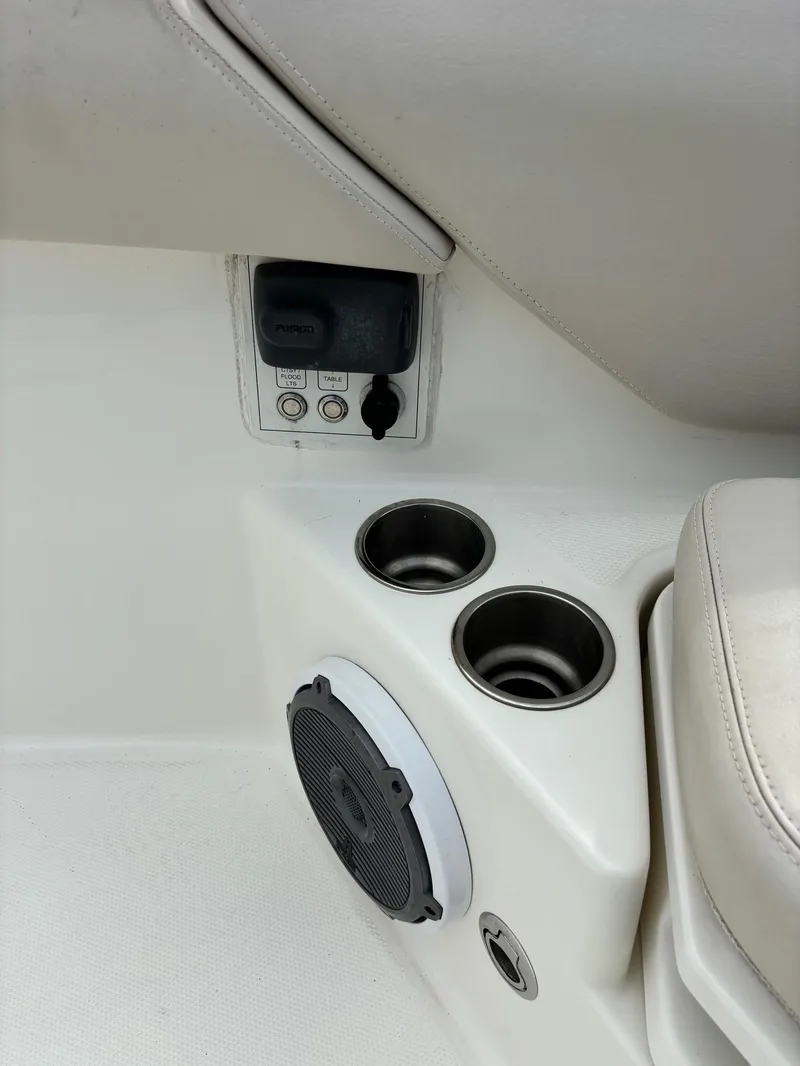 Slide: The Image of 2017 Boston Whaler 420 Outrage interior with cup holders and speaker system. - 37