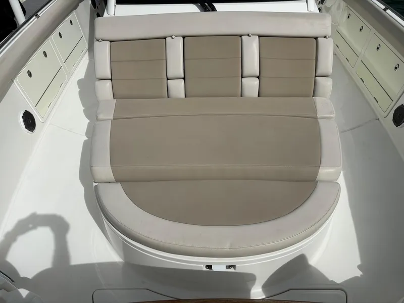Slide: The Image of Boston Whaler 420 Outrage 2017 boat seating area with beige cushions. - 39
