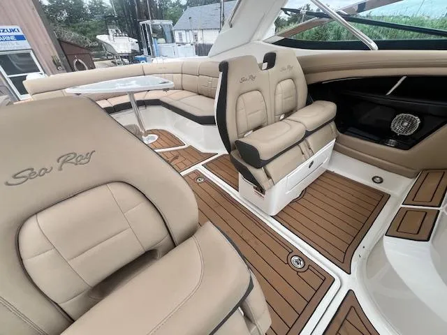 Slide: The Image of Luxurious interior of 2016 Sea Ray 350 SLX boat with tan leather seating. - 13