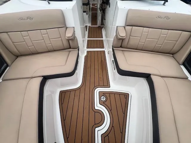 Slide: The Image of 2016 Sea Ray 350 SLX boat interior with tan leather seating and teak flooring. - 16