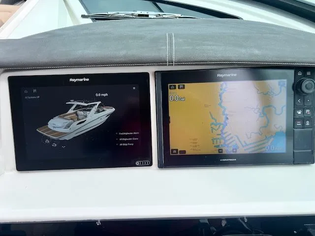 Slide: The Image of Dashboard of a 2016 Sea Ray 350 SLX with Raymarine navigation displays. - 5