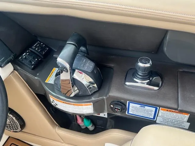 Slide: The Image of Control panel of a 2016 Sea Ray 350 SLX boat with throttle and joystick. - 6